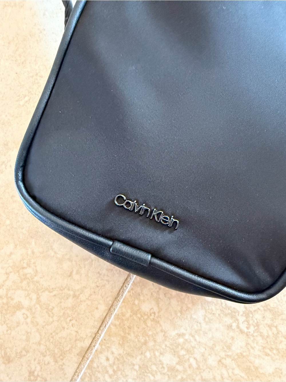 Calvin Klein Black Crossbody Bag with Logo Hardware and attached earbud Case